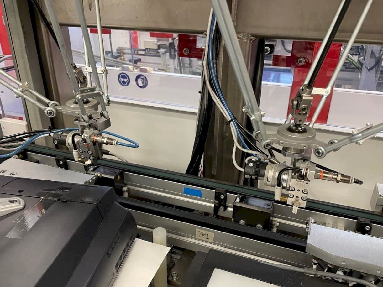 Vue de face de la machine IMS Tattoo Assembly Line