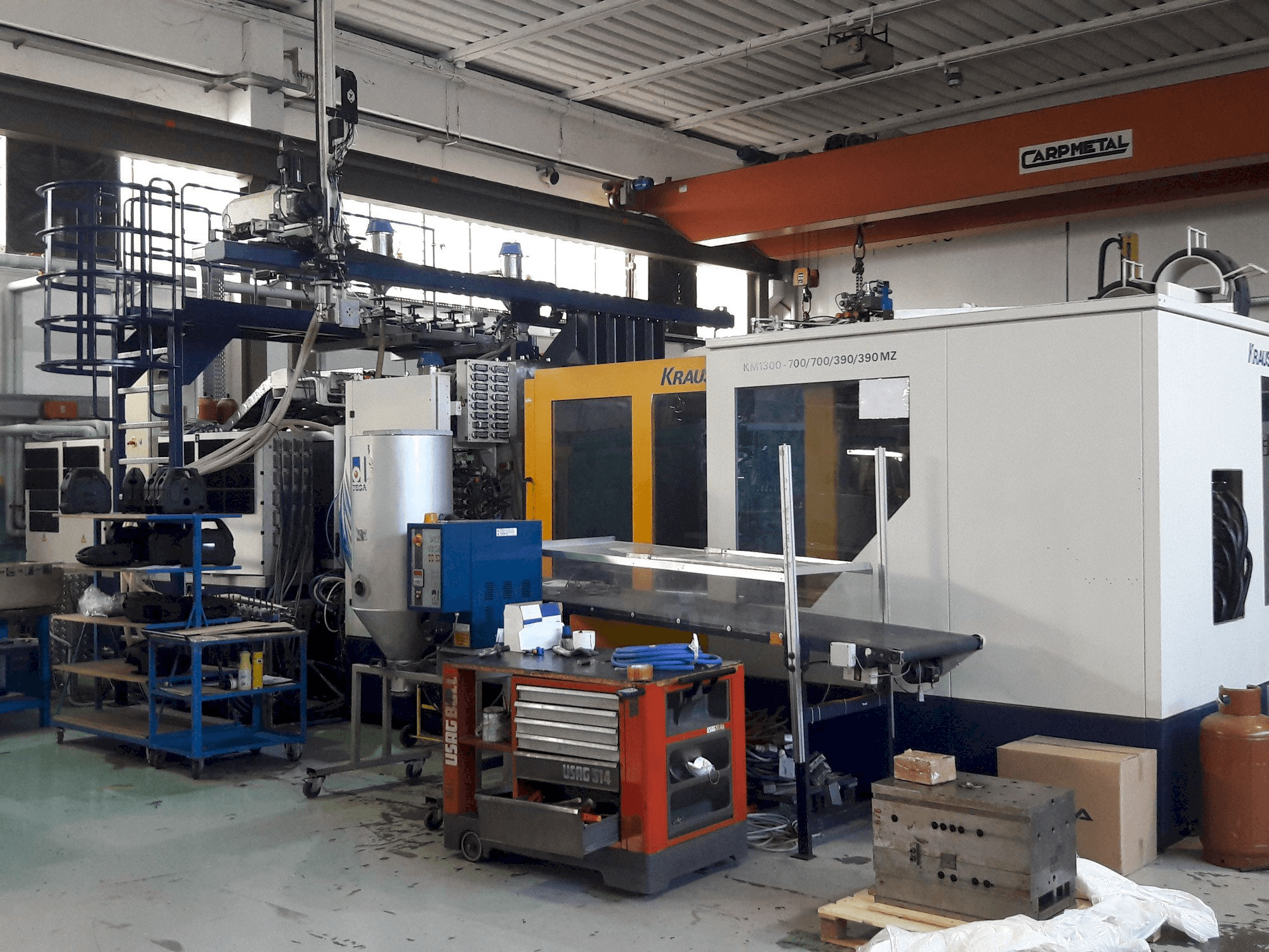 Front view of Krauss Maffei 1300-700-700-390-390 MZ machine