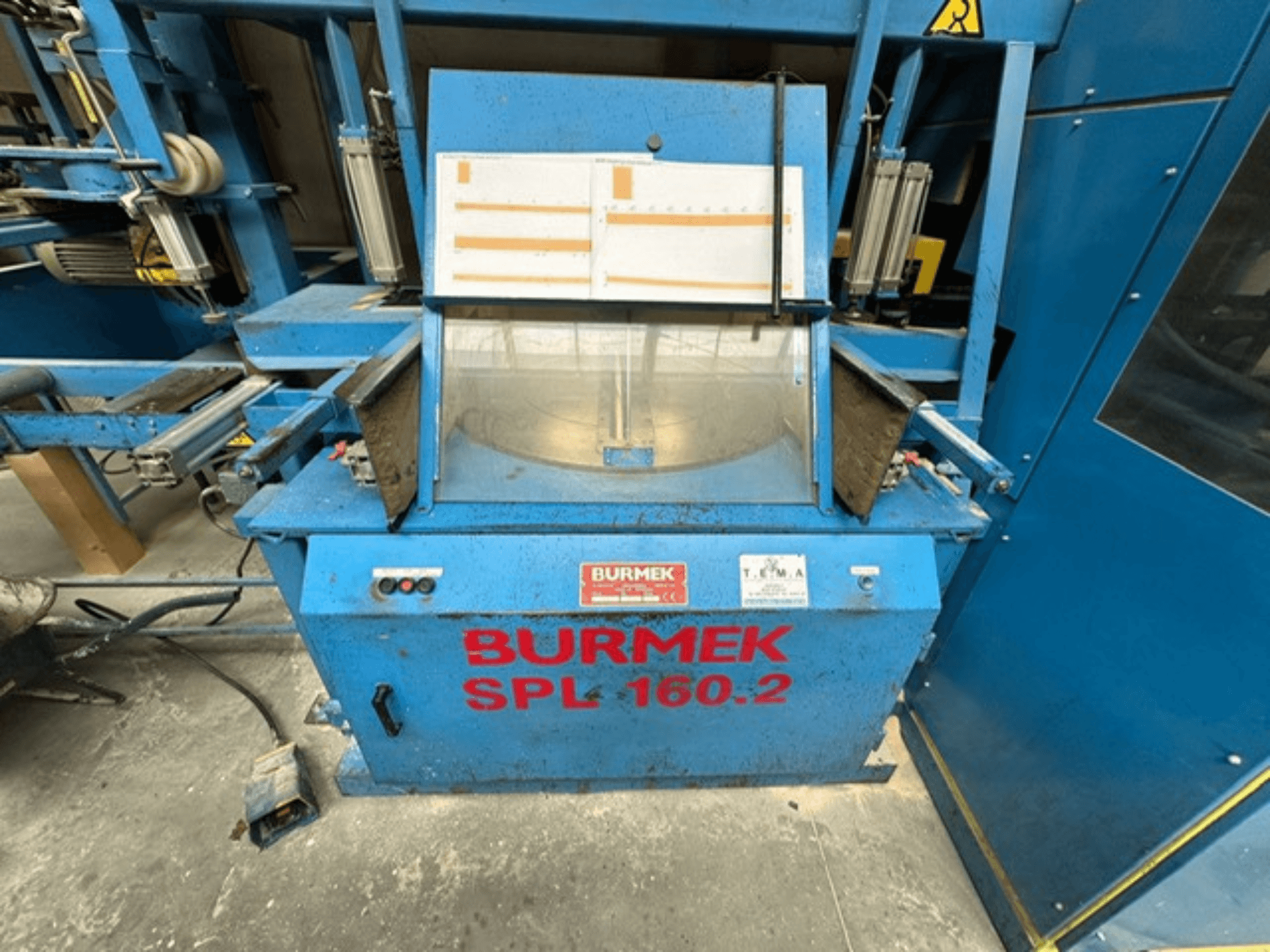 Machine à bois bleue BURMEK SPL 160.2, vue de face, avec boutons de commande et panneau de verre présentant l'intérieur.