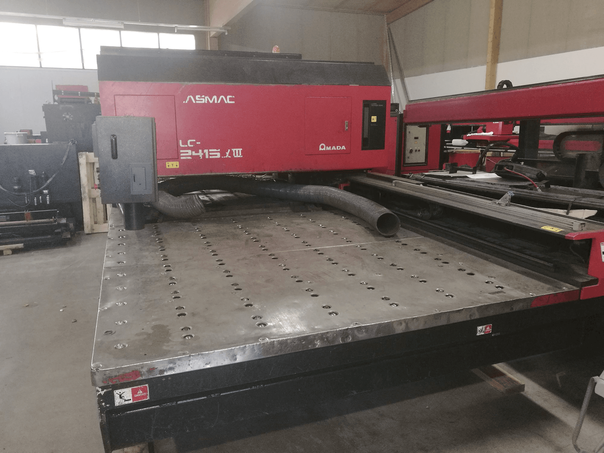 Front view of AMADA LC 2415 α3 Machine