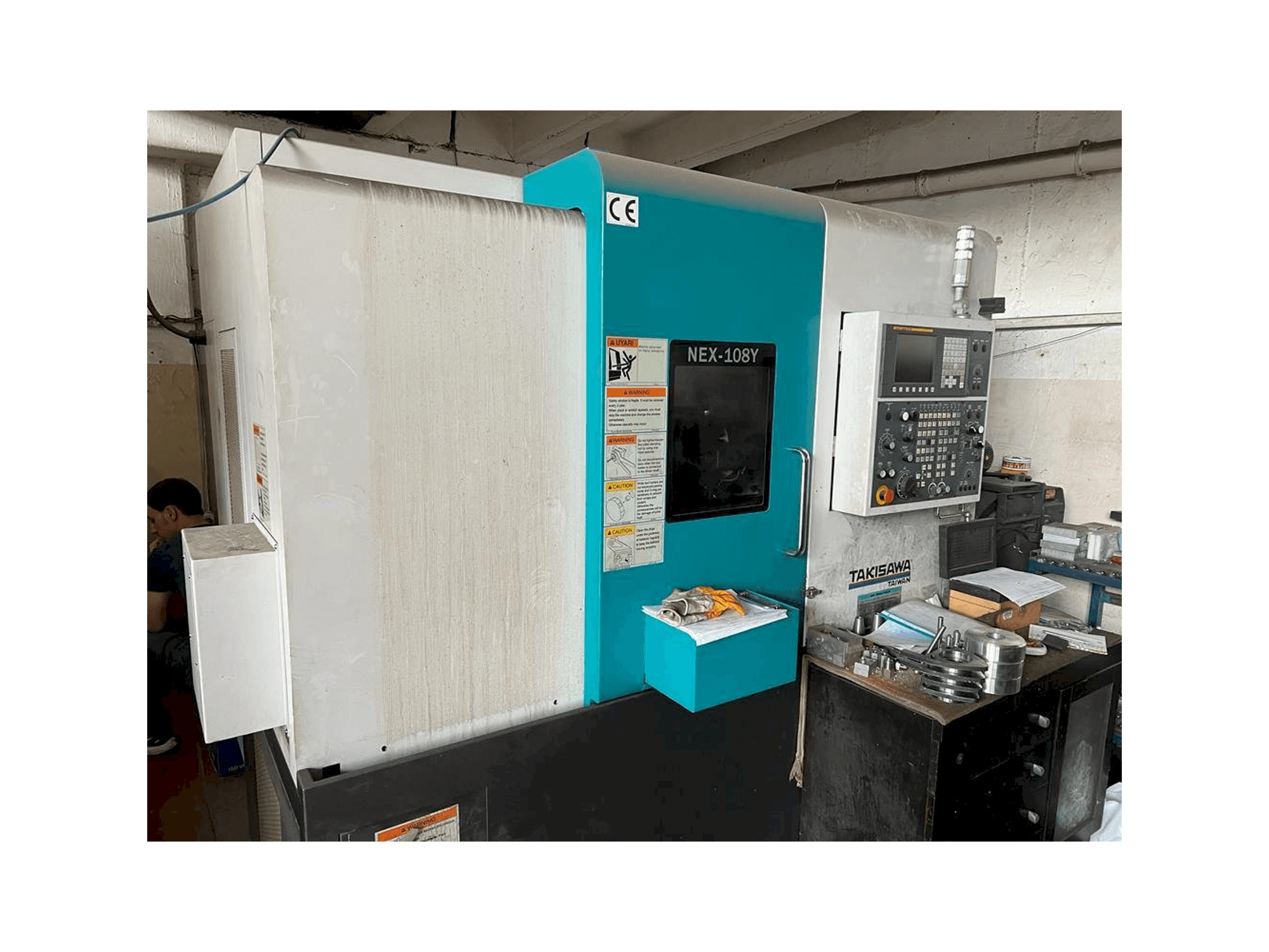 Vue de face de la machine Takisawa NEX-108Y