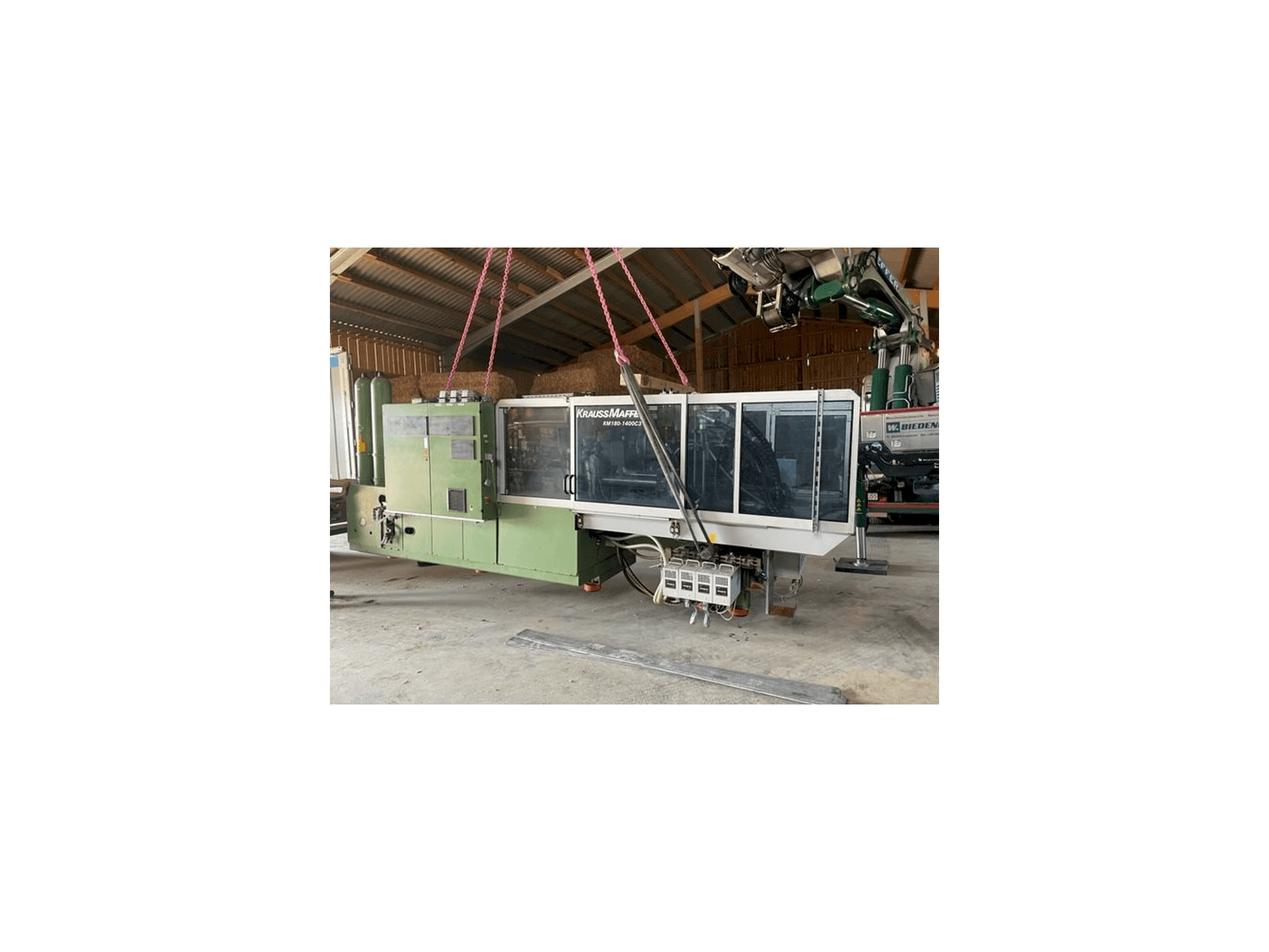 Front view of Krauss Maffei KW180 C3 hybrid machine