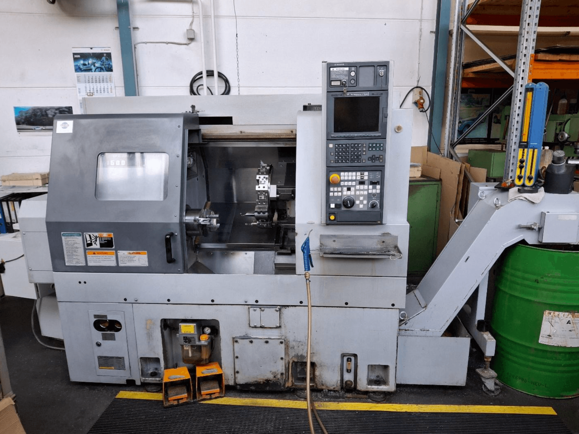 Tour horizontal MORI SEIKI CL 1500 T, vue de face avec le panneau de commande, les outils visibles et l'affichage opérationnel.