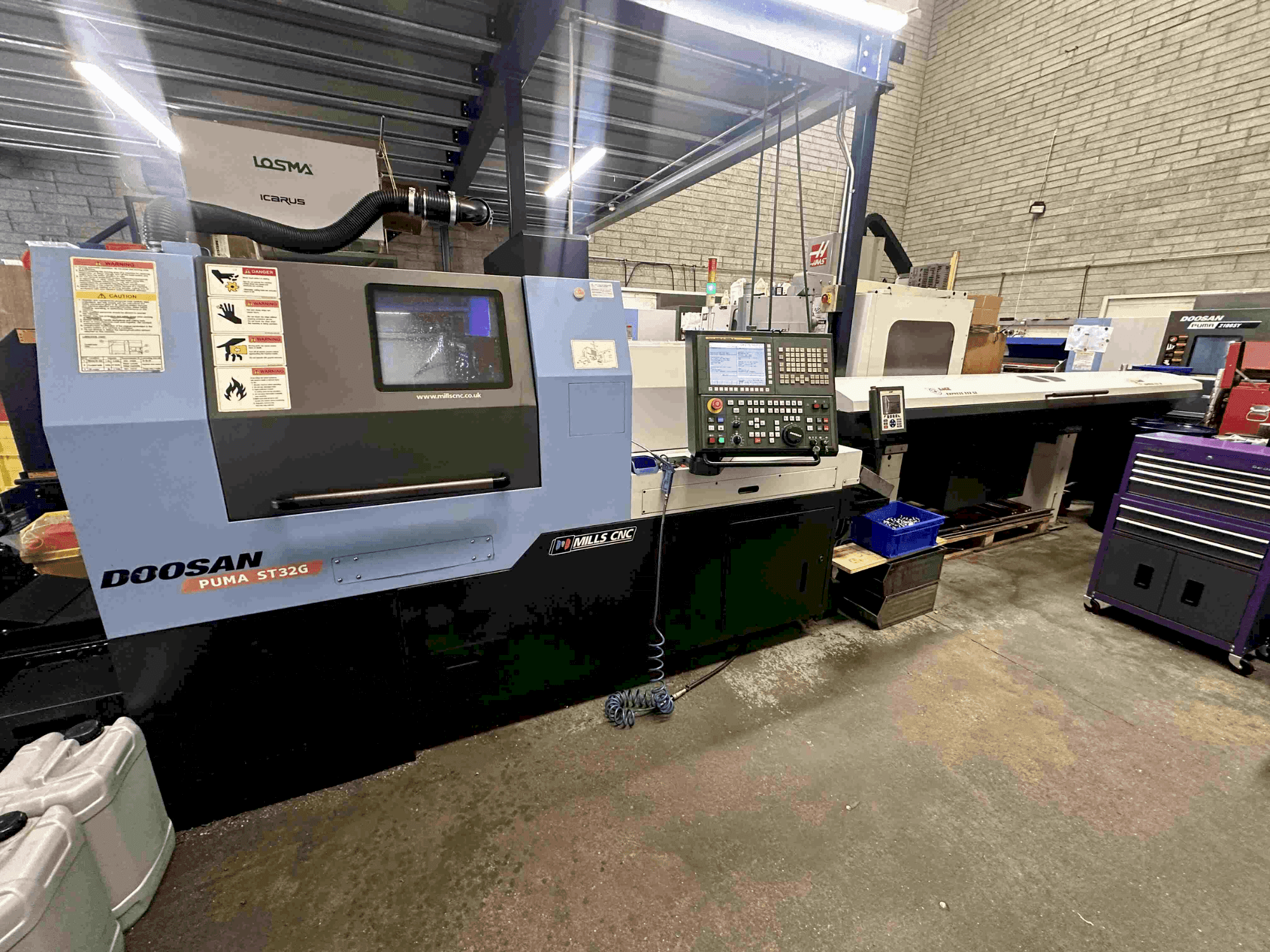Vue de face de la machine DOOSAN Puma ST32G