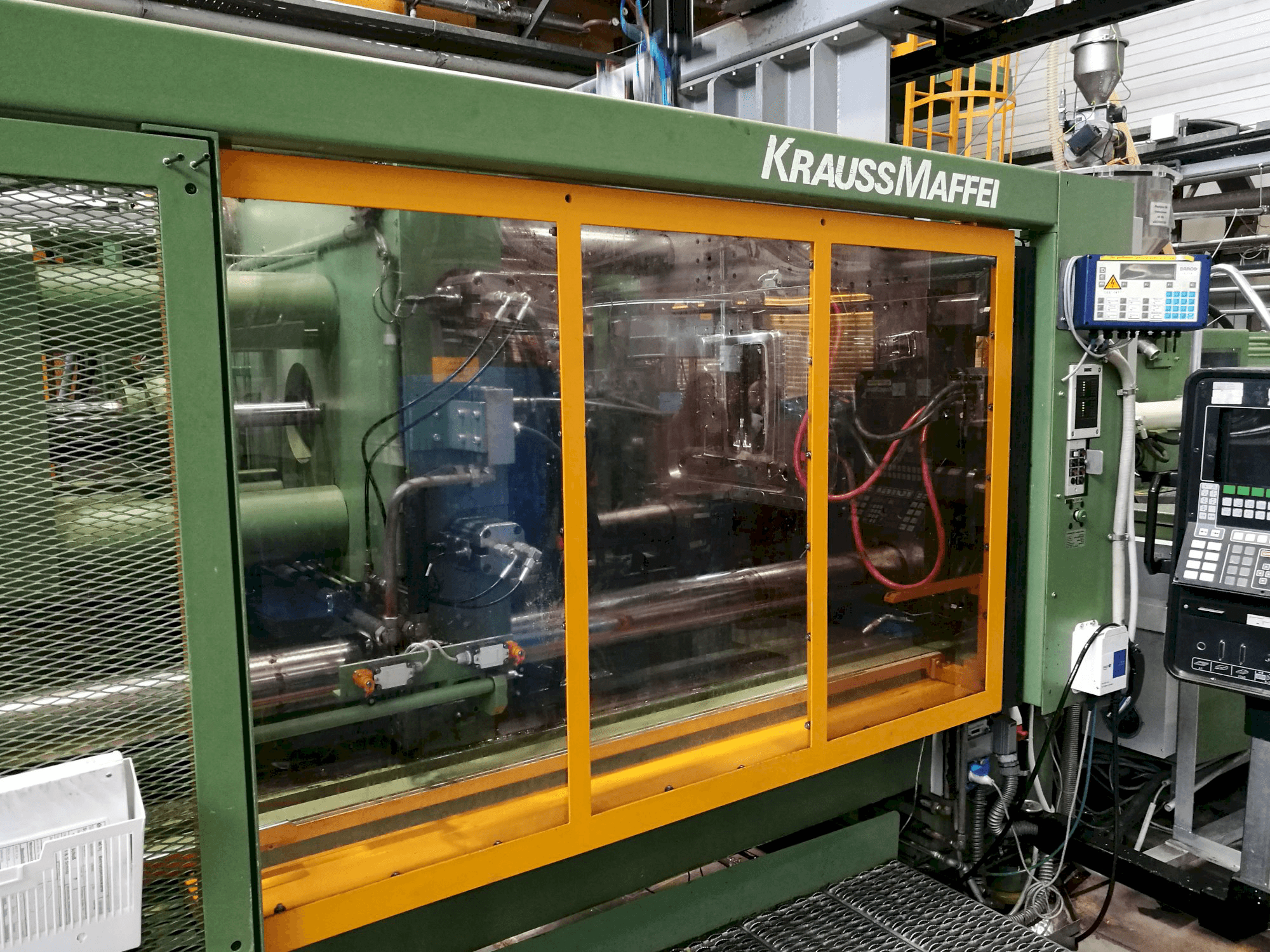 Left view of Krauss Maffei 650-2300 B2 Machine