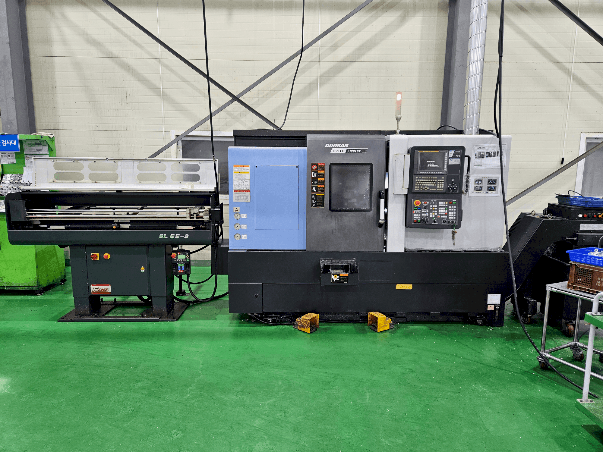 Vue de face de la machine DOOSAN LYNX 2100 LSYB