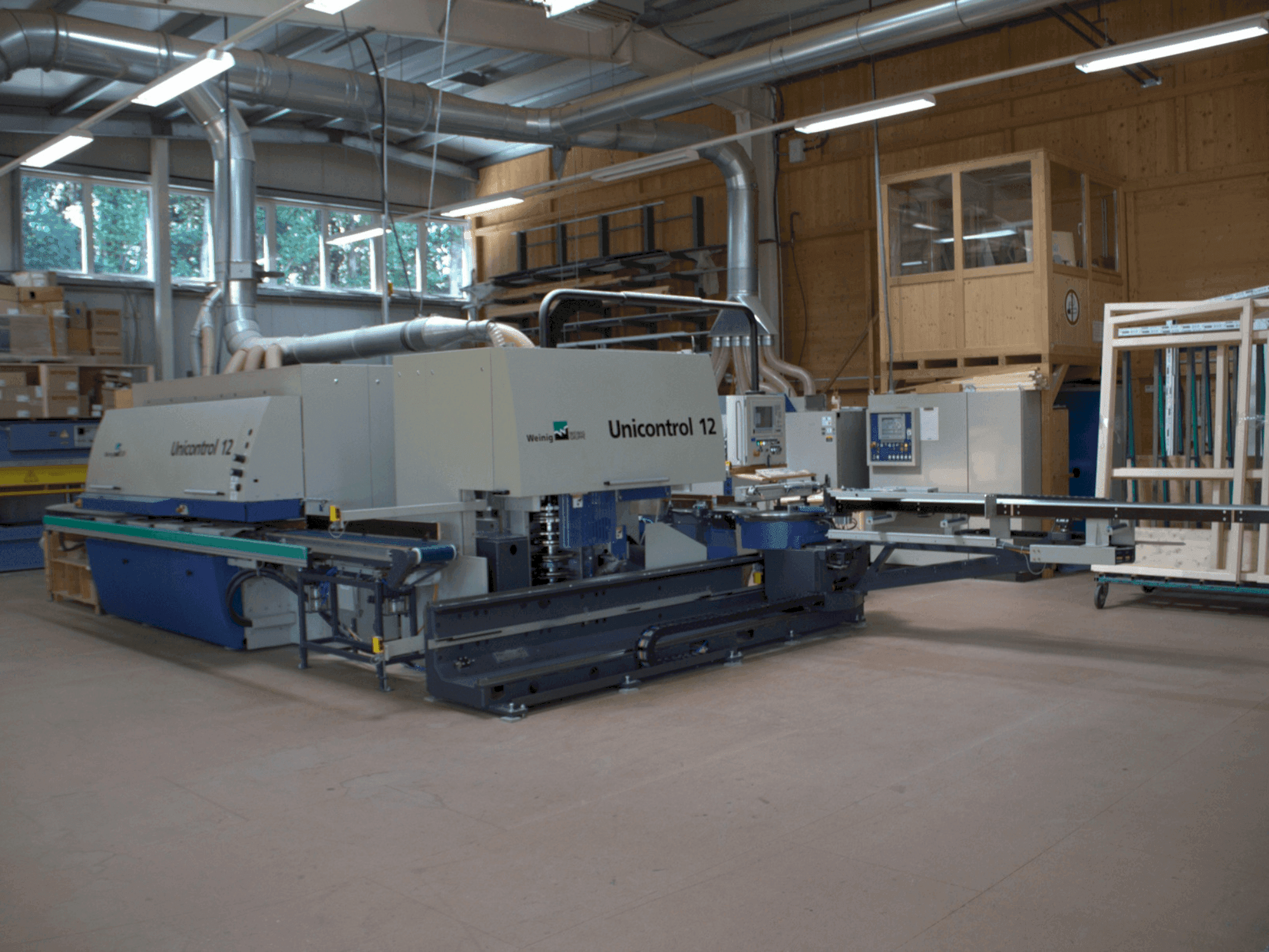 Vue de face de la machine WEINIG / DIMTER UNICONTROL 12